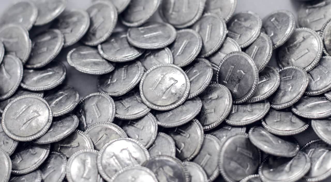 reproduction 17th regiment buttons in a big pile.